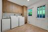 Laundry/mud room off kitchen and garage