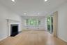 Main floor Family Room with Fireplace and door to deck