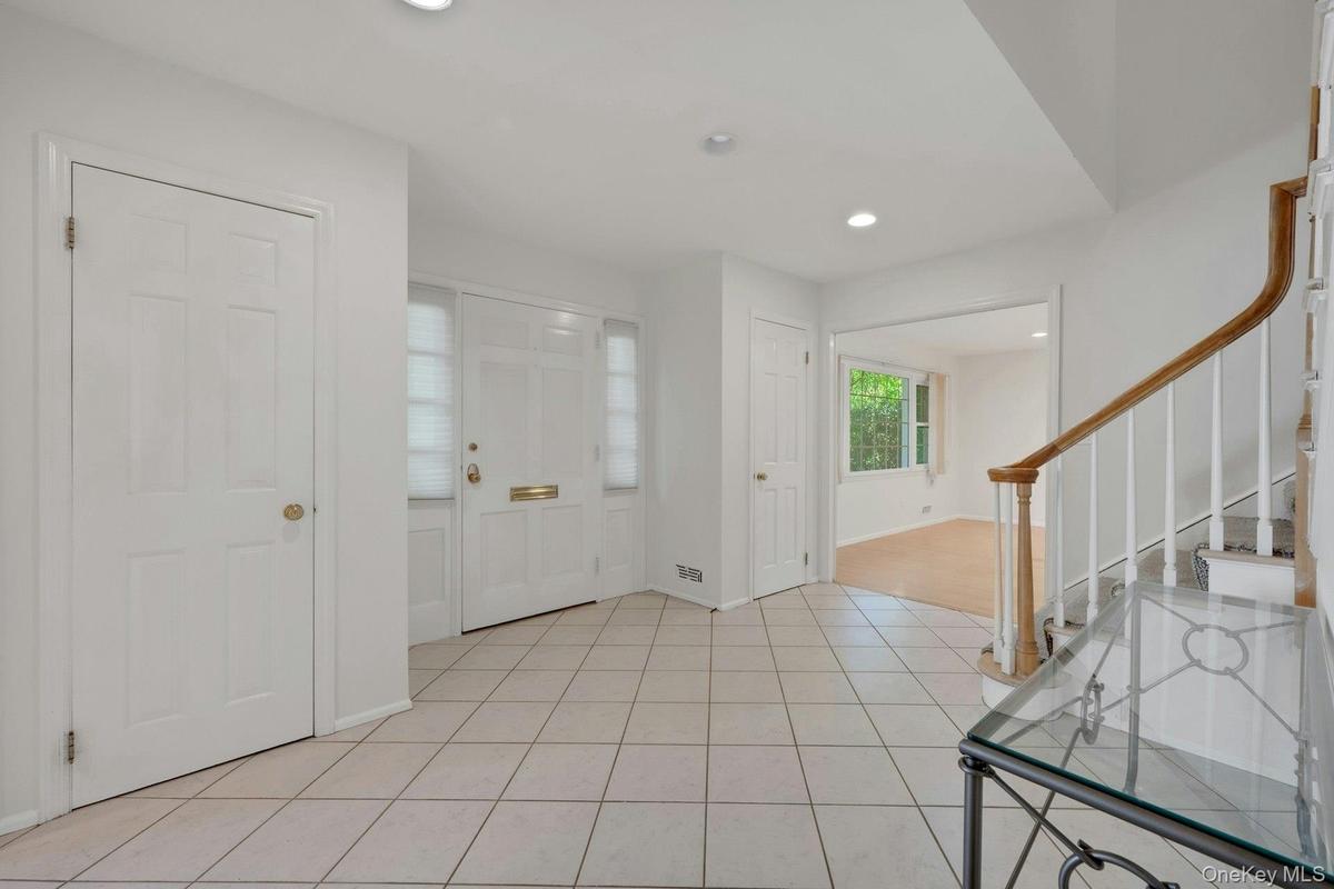 Double coat closets in Foyer