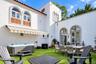 Courtyard with turf and retractable awning