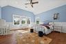 Vaulted ceiling with a wood-finish ceiling fan, recessed lighting, and rich wood-finish flooring