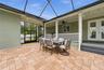 Covered porch overlooking screened lanai