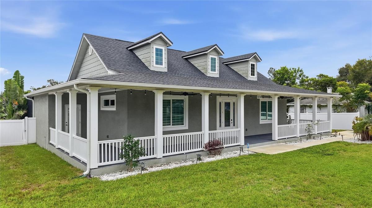 Front of home with 1,100 sq ft wrap around porch