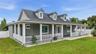 Front of home with 1,100 sq ft wrap around porch