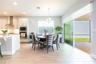 Inviting breakfast nook beside the kitchen, with sliding glass doors opening to the covered patio.