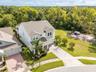 Aerial view showcasing conservation surroundings with no rear neighbors or neighboring home on the right.