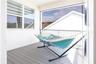 Covered upstairs balcony overlooking a conservation area, ideal for relaxing.