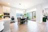 Charming breakfast nook with sliding glass doors opening to the screened, covered patio.