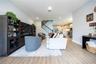 Inviting living room flowing seamlessly into the kitchen and breakfast area, ideal for entertaining.
