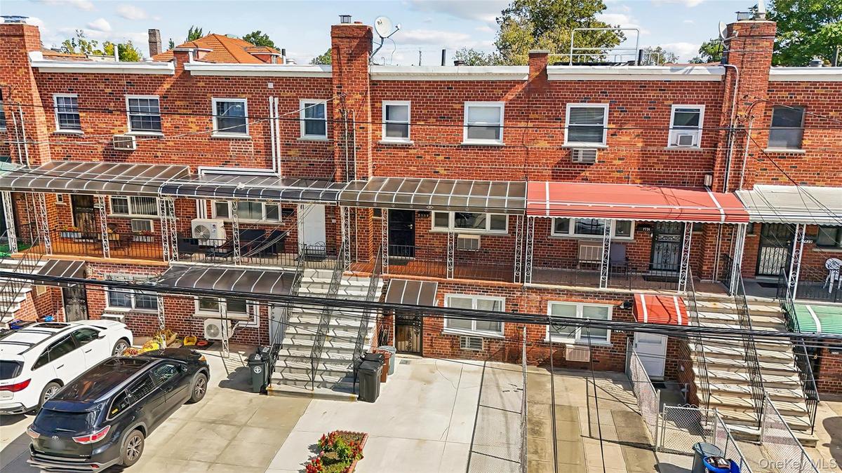 Brick exterior with multiple windows and covered entryways