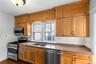 cabinets floor to ceiling, granite counters, window over sink