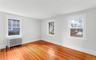 2 of 3 bedrooms with hardwood floors, radiator