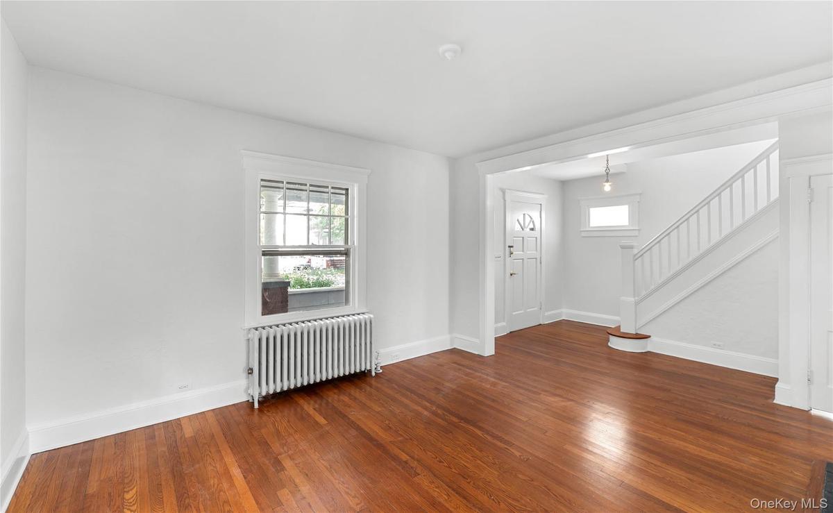 living room, radiator heating. entrance way and stairway