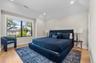 Hardwood flooring, recessed lighting, and a large window with dark trim