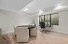 Recessed lighting, light wood-finish flooring, and a large window