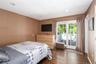 Main floor primary bedroom with walkout to deck.