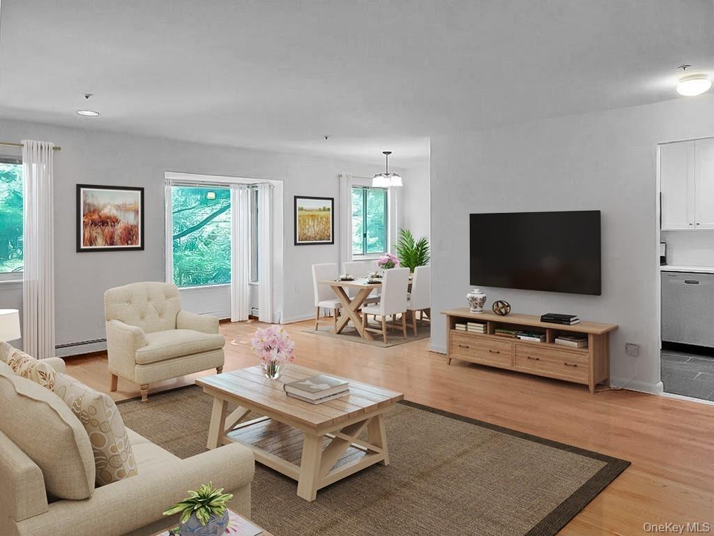 Spacious Great Room Open to the Dining Room and Kitchen Virtually Staged