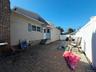 Back yard with main and second floor entry.