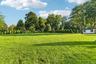 Over 1 Acre of manicured property.  Storage Shed.