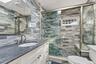 Walk-in shower with seat.