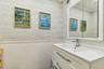 Half Bathroom off entry foyer.