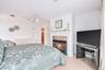Wood-finish flooring, ceiling fan, built-in fireplace