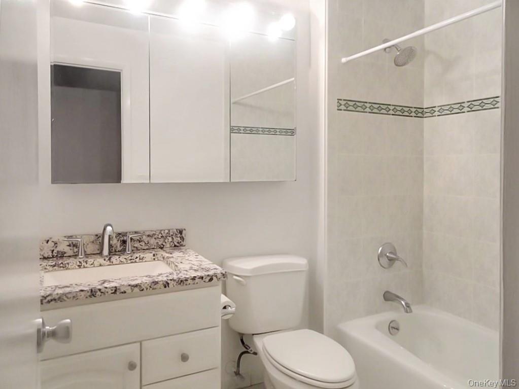 Bath located across from the second bedroom
