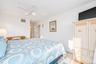 En Suite featuring large walk-in closets