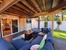 Covered porch with TV and fire pit