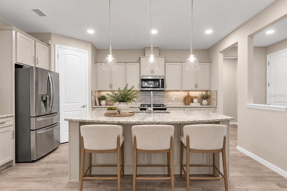 Kitchen with center island and gray cabinetry