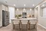 Kitchen with center island and gray cabinetry