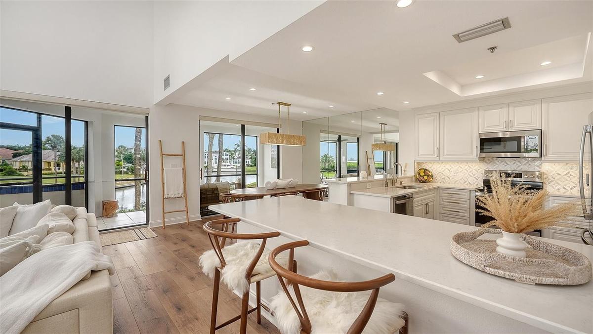 THE KITCHEN ISLAND IS A FUN ENTERTAINING AREA