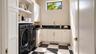 Laundry room. Virtually staged.