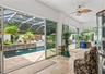 3 Sets of Sliding Glass Doors Overlooking Pool Area