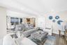 Family Room Features Custom Mother of Pearl Bar Cabinet
