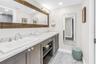 Primary En-Suite Features Quartz and Glass Enclosed Shower