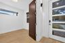 Foyer and large office-den-5th bedroom-double wood doors.