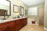 Owners en-suite bathroom with garden tub, new vanity, granite counters and walk-in shower