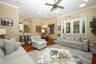 Family room looking in to breakfast nook and french doors leading to screened porch