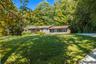 Convenient one-level living meets timeless country charm in this delightful ranch-style home, set high atop almost an acre and perfectly positioned fo