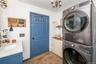 Newer full sized stacked washer and dryer.