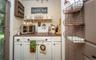 And could easily become the perfect coffee bar. Door on the left leads to the back patio.