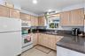 Kitchen with wood-tone cabinetry and ample counter space