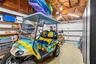 Alternate garage view. Golf cart excluded; available for separate purchase.