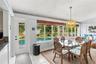 Florida room with access to the screened pool patio.