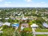 Aerial view of the home and surrounding neighborhood with close proximity to Gulf.