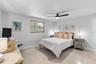 Primary bedroom with coordinating coastal furnishings.