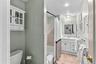 Guest bathroom with vanity and tub/shower combination.