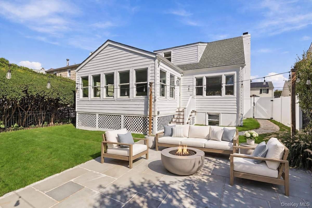 Patio furniture is virtually staged.