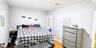 Light-toned walls complement wood-finish flooring